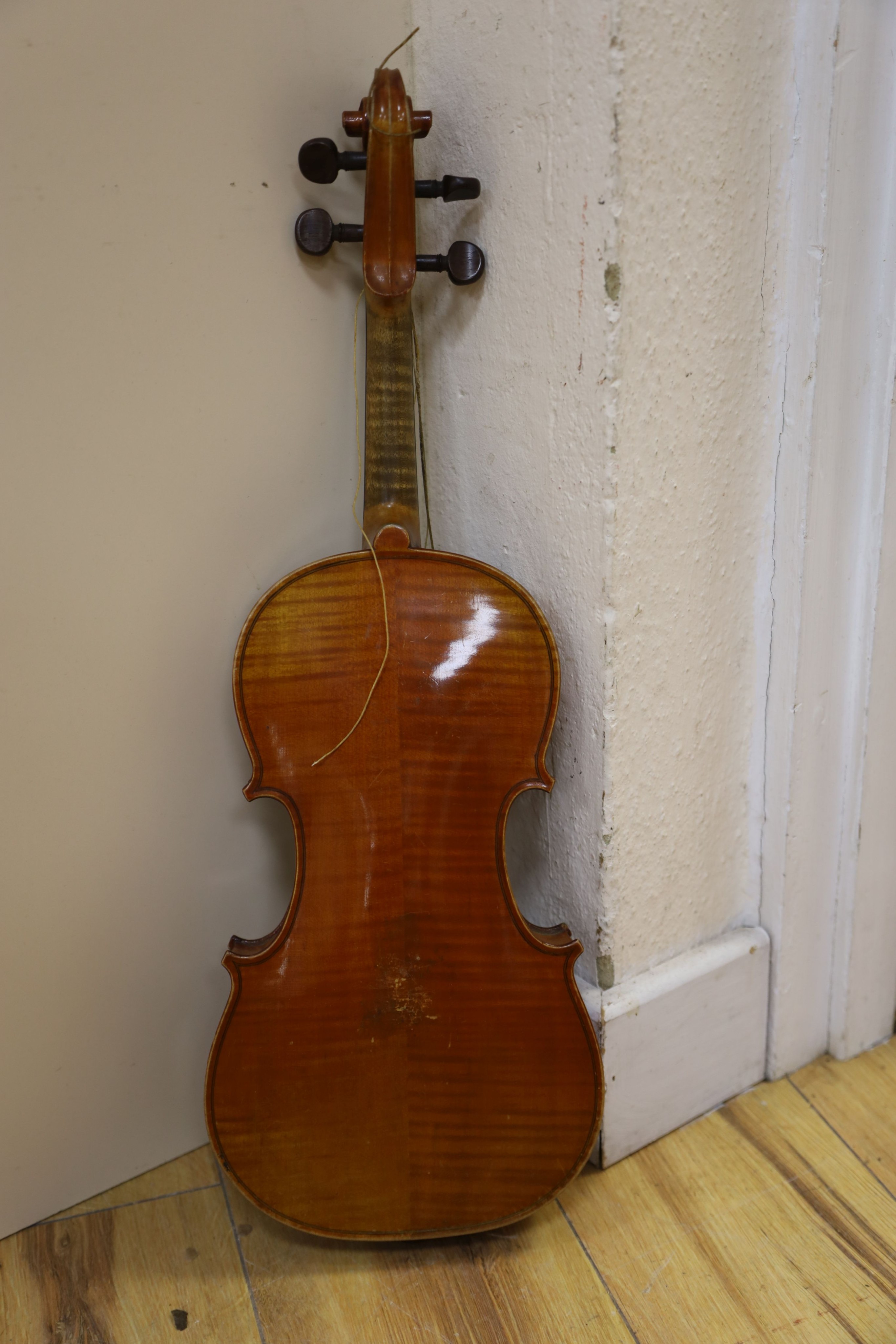 A Stradivarius copy violin and two bows and another bow, both cased, backs 33cm and 30cm